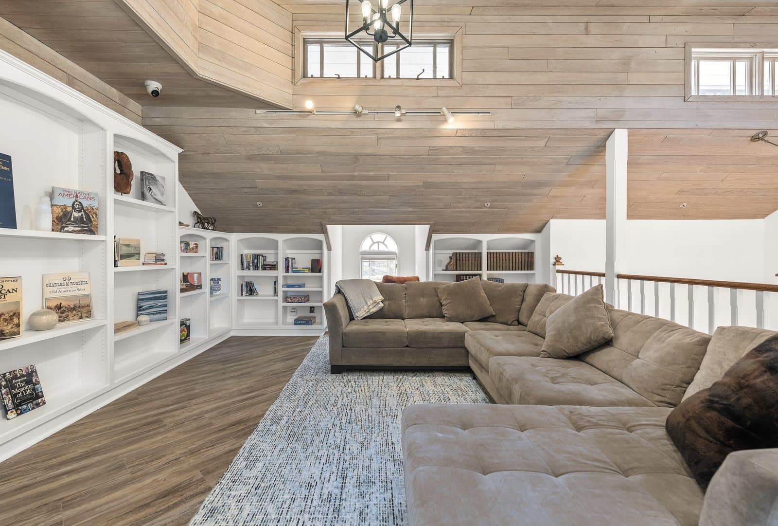 Bright residential interior with built-in shelves and lounge seating